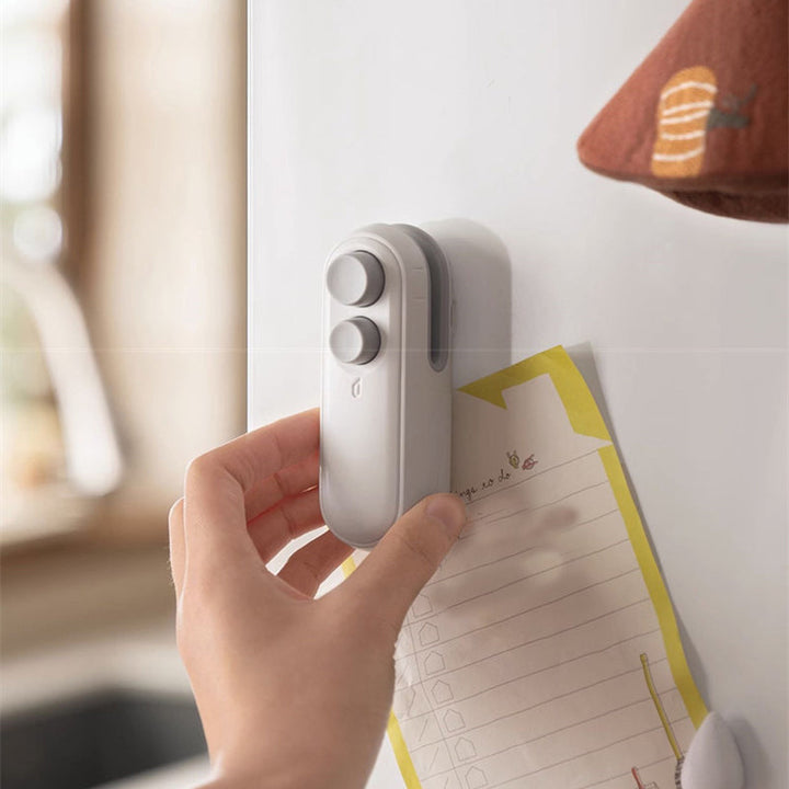 Vikbua™ Oppladbar mini-poseforsegler med innebygd kniv