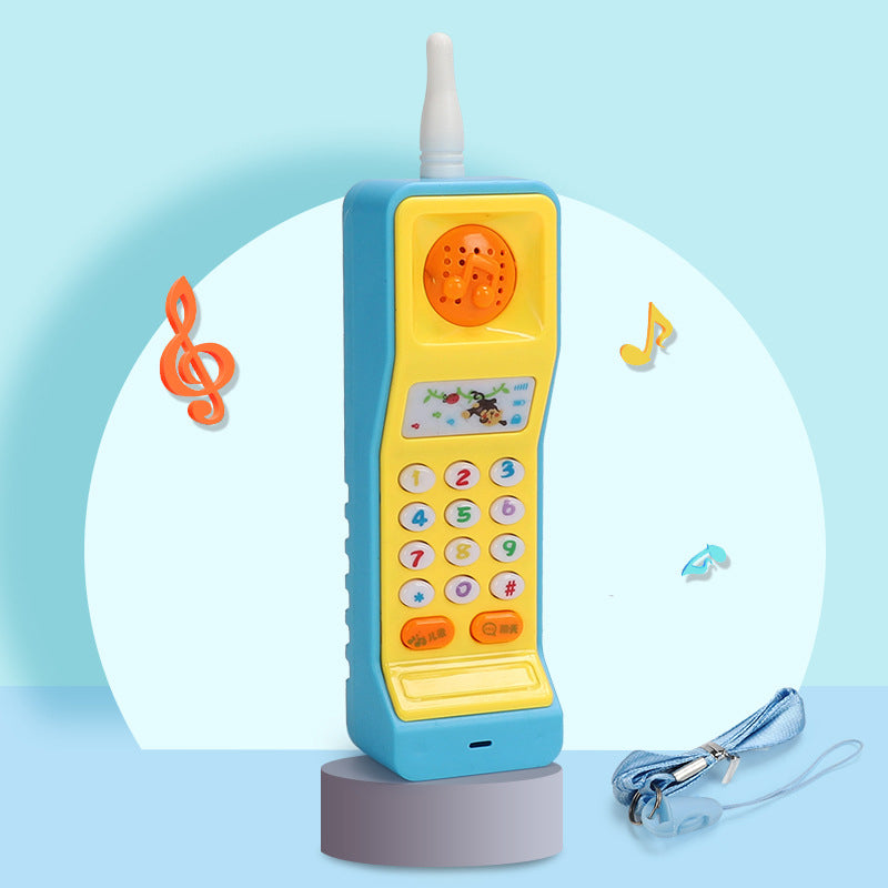 Leketelefon formet som gulrot med knapper