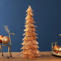 Lite oransje fjærjuletre med glitter