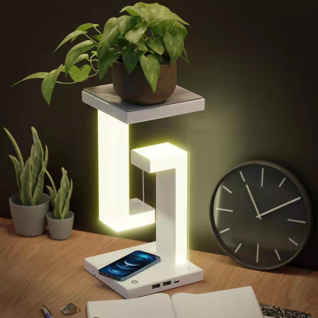 Hvit svevende lampe med mobillader