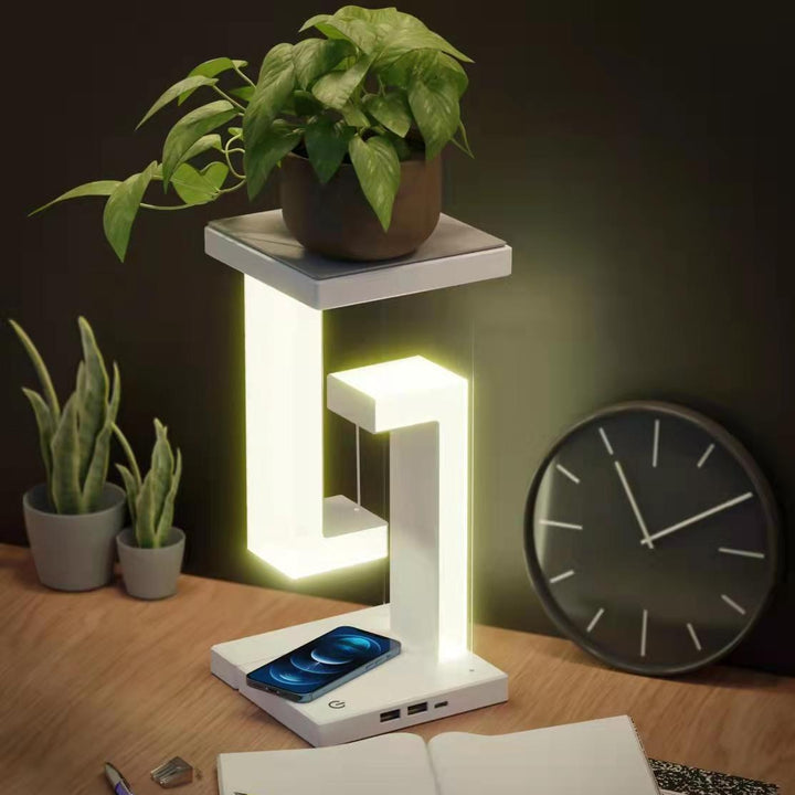 Hvit svevende lampe med mobillader