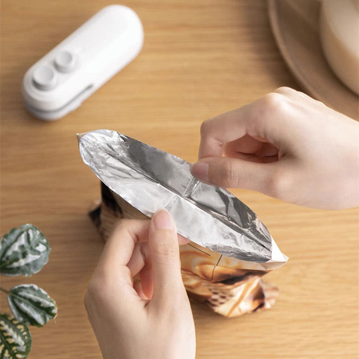 Vikbua™ Oppladbar mini-poseforsegler med innebygd kniv