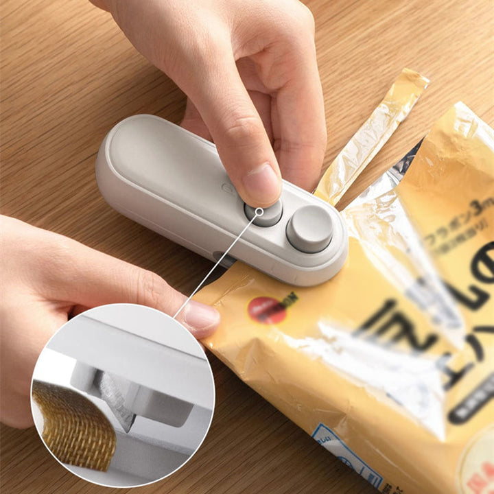 Vikbua™ Oppladbar mini-poseforsegler med innebygd kniv