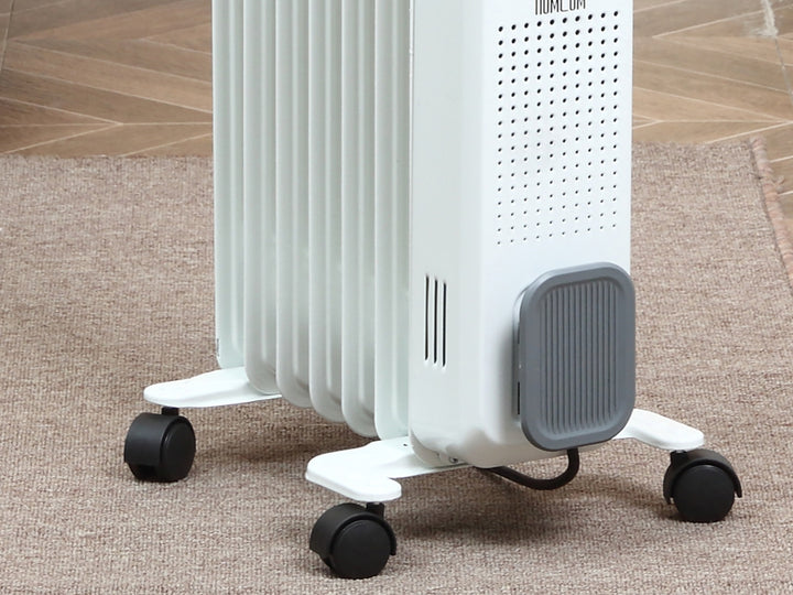 Hvit oljefylt radiator med sju ribber