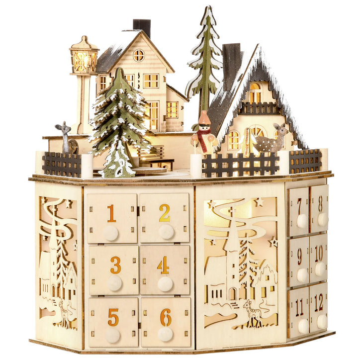 Adventskalender i tre som julelandsby med lys