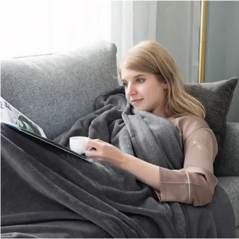 Vikbua™ Vanntett vendbart pledd til sofa og seng