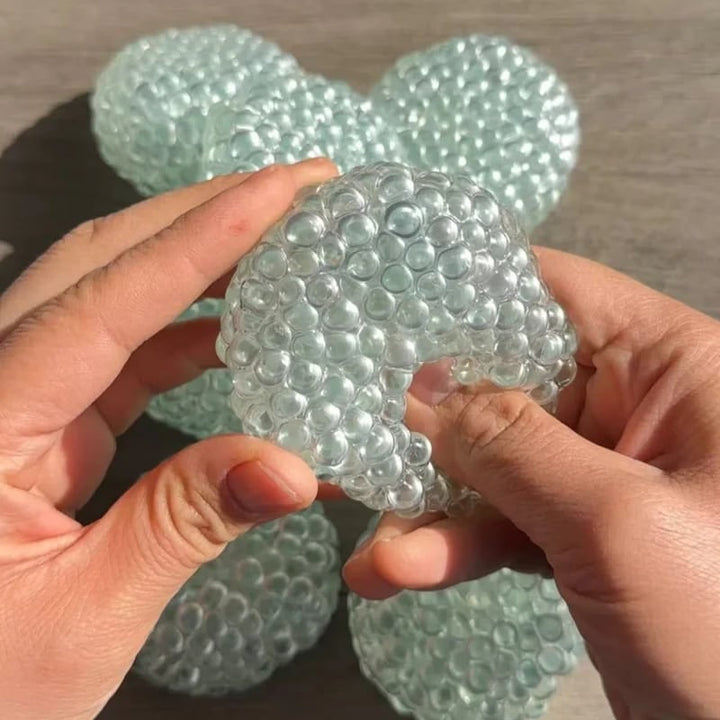 Vikbua™ Squishy stressball formet som dumpling med gelkuler